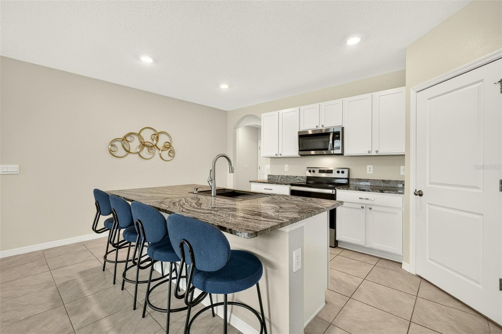 Bright and open kitchen space - freshly painted throughout the home - 17206 RESERVA DR, BRADENTON