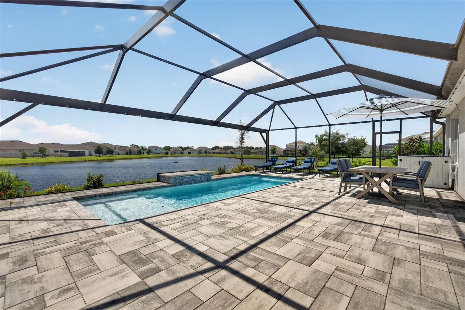 Large pool deck area for entertaining - south facing so lots of sunshine! Pool includes a solar cover to keep pool warm and easier on heating costs - 17206 RESERVA DR, BRADENTON