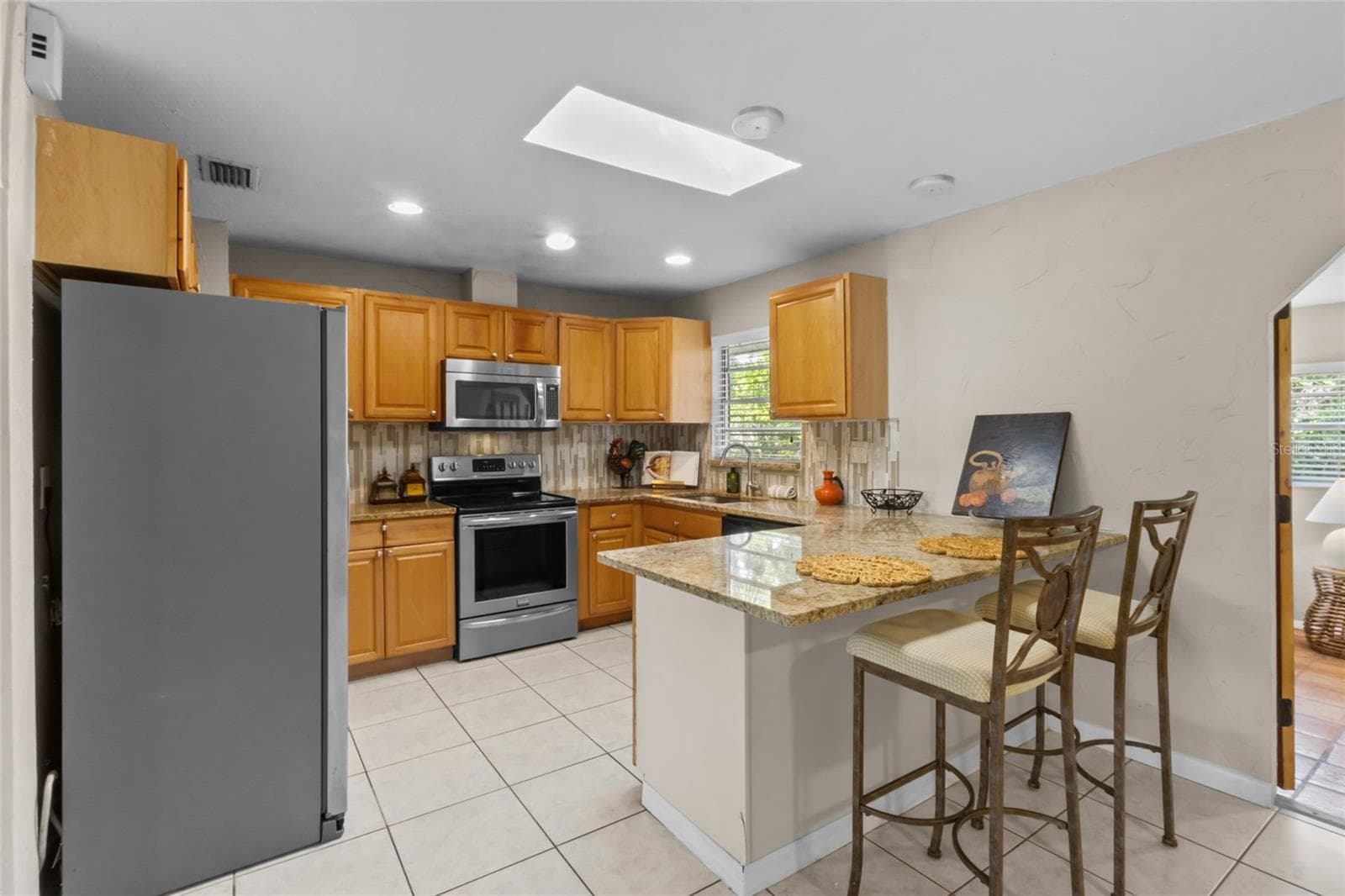 Kitchen with Granite Countertops/Tile Backsplash - 2520 E MILMAR DR, SARASOTA