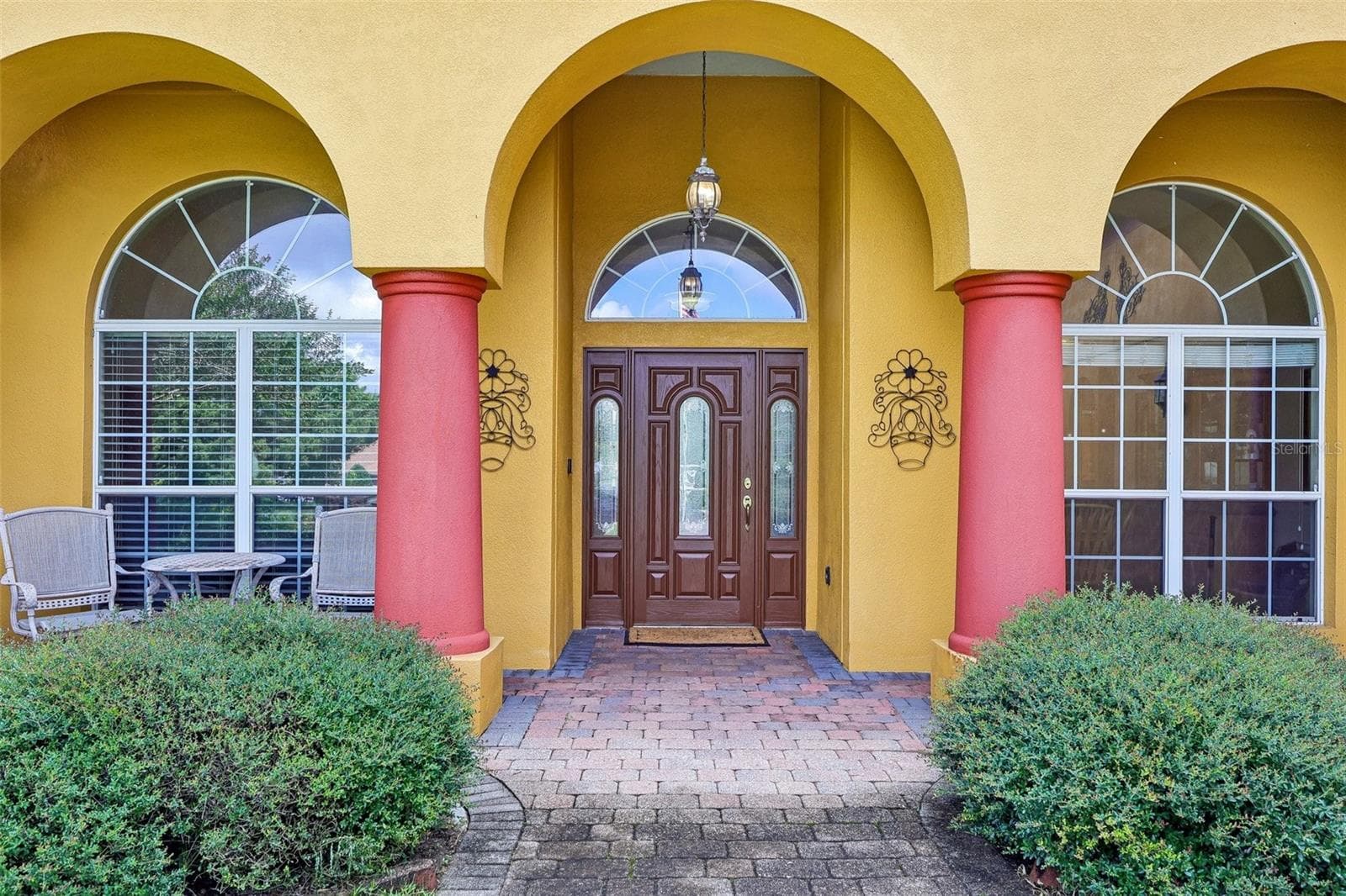 Front Entry with large paver walkway and front porch to welcome guests - 32736 WOLFS TRL, SORRENTO