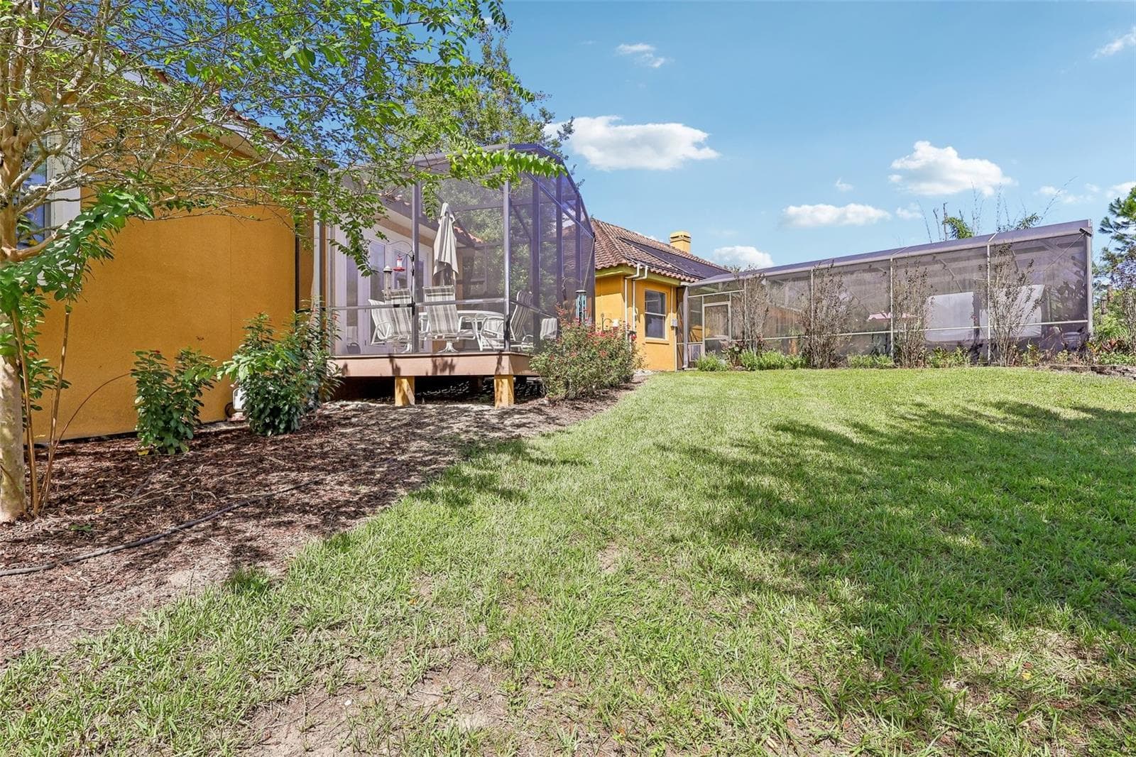 Rear view of Casita Screened Porch and Main Home Lanai - 32736 WOLFS TRL, SORRENTO