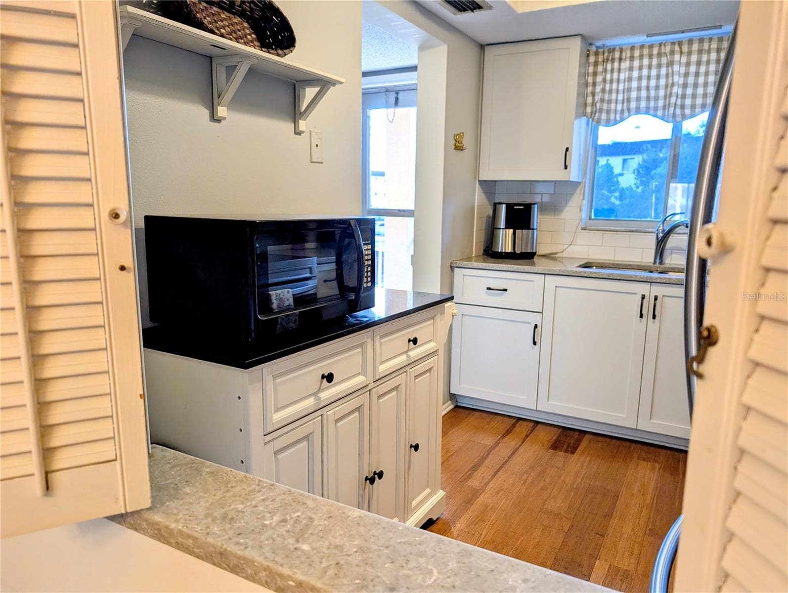 Convenient pass-thru from kitchen to dining area - 4133 HERON WAY #E-202, BRADENTON