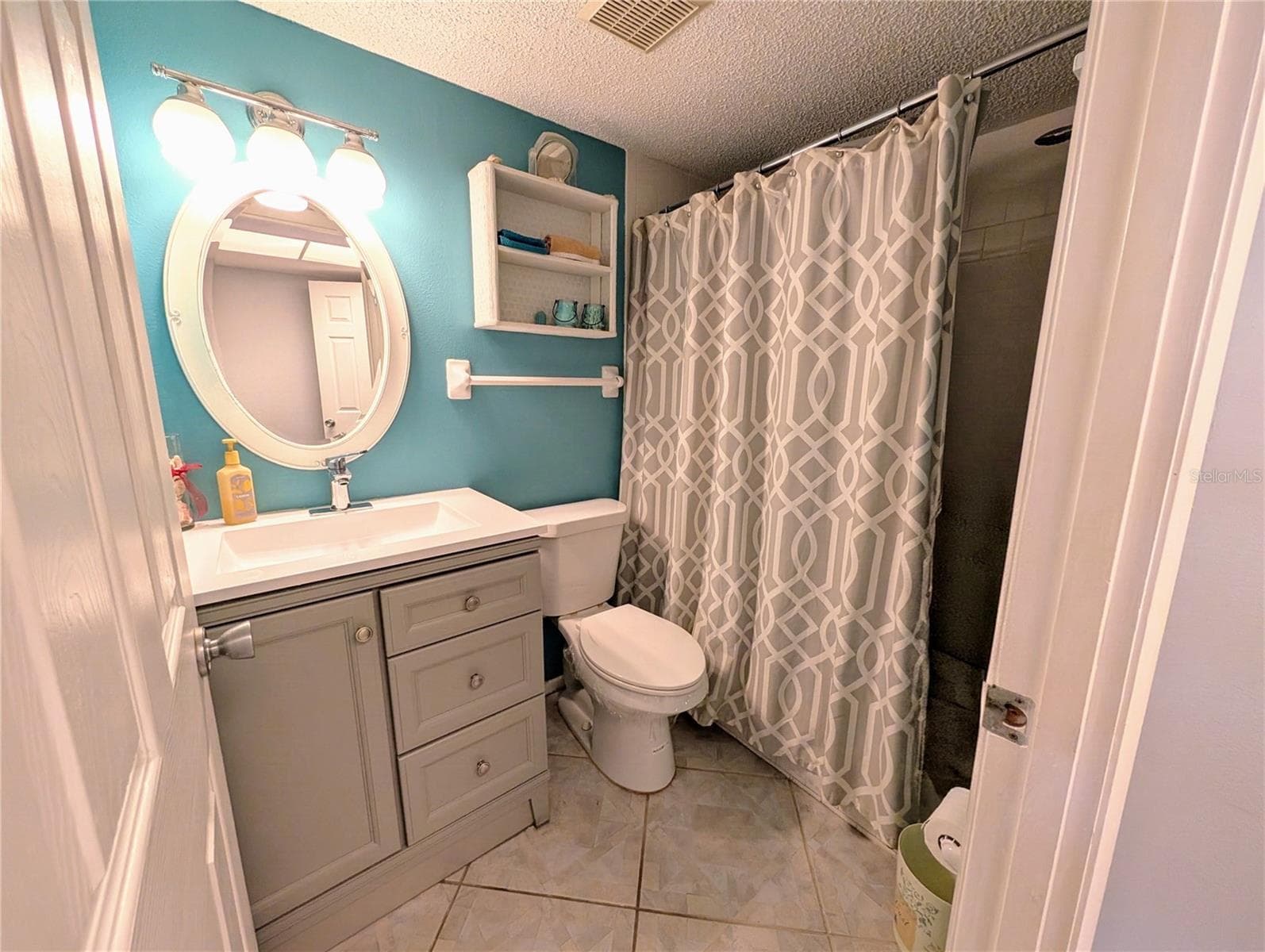 Master bath...note diagonal tile flooring & upgraded features - 4133 HERON WAY #E-202, BRADENTON