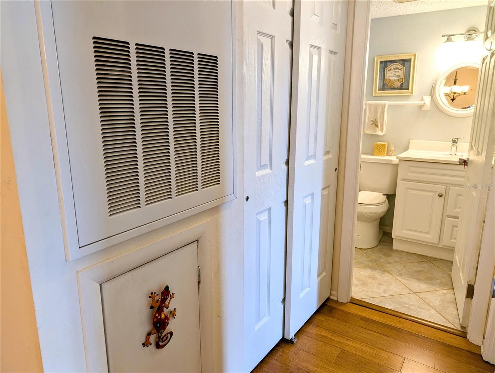 Hallway to 2nd bedroom/bathroom; updated all interior doors. - 4133 HERON WAY #E-202, BRADENTON