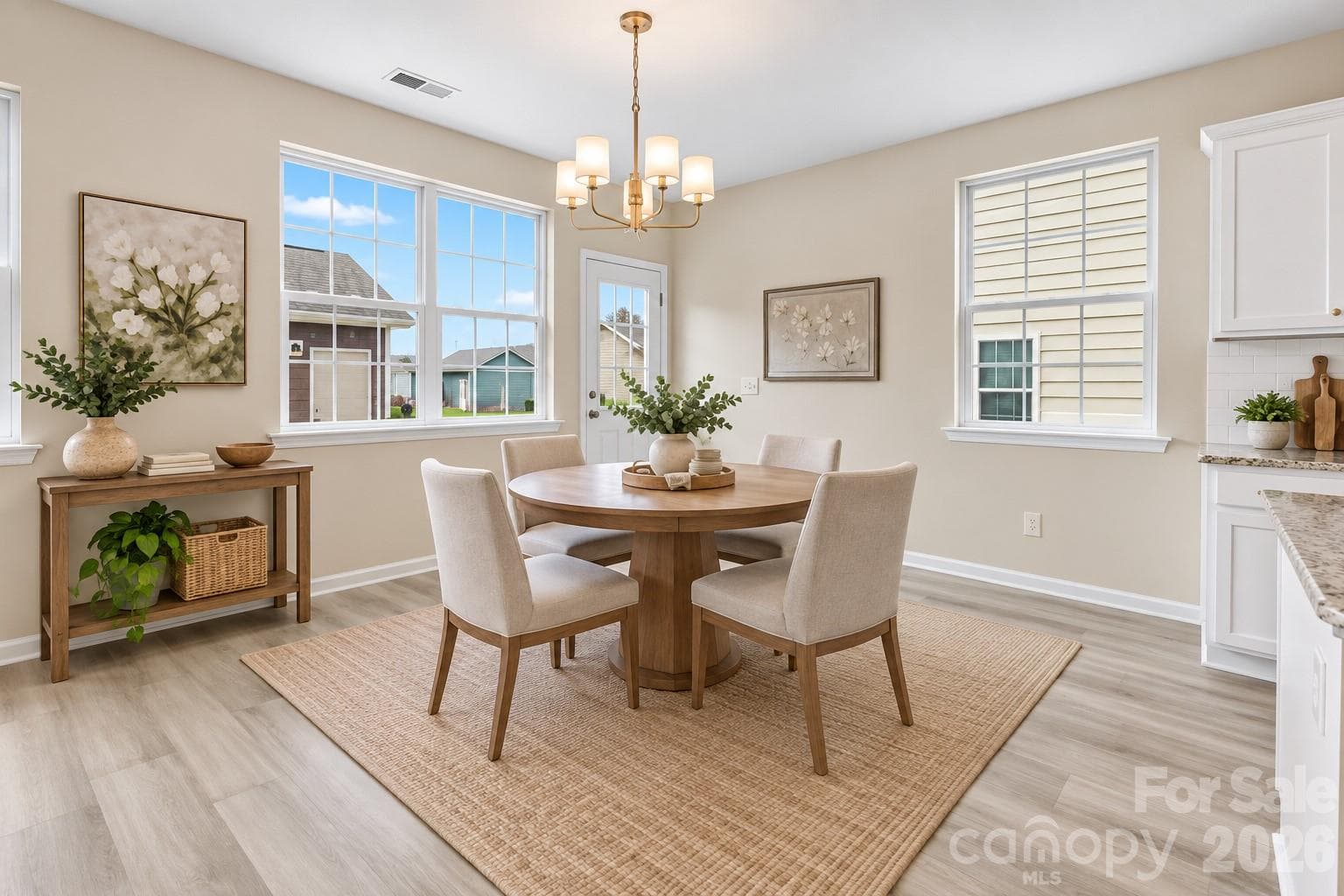 Inviting breakfast area offers a sunny spot for casual dining with easy access to the kitchen and backyard - 2015 Kensley Drive, Waxhaw