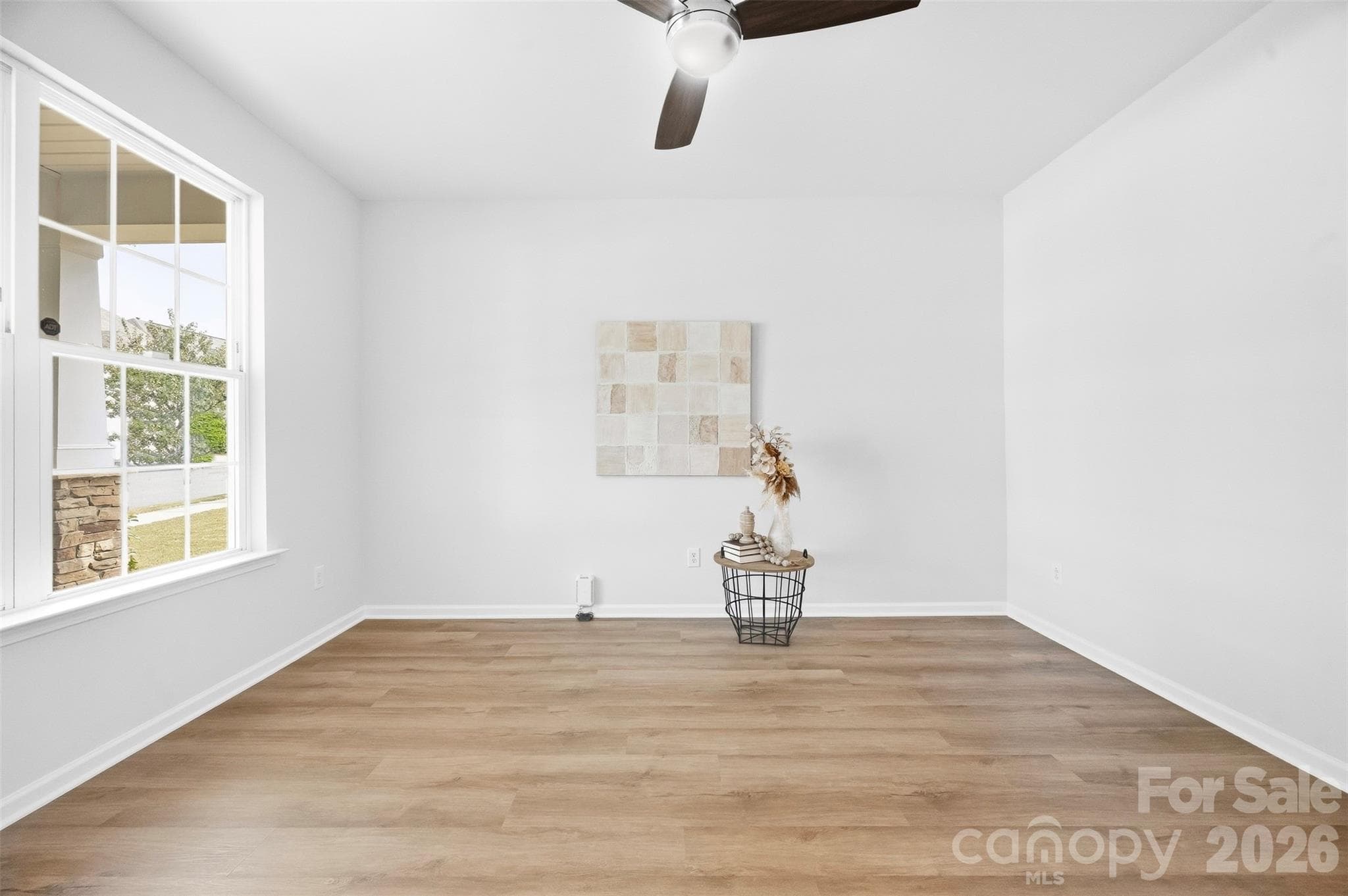 Beautifully refreshed main level features new LVP flooring throughout, fresh paint, and updated lighting for a bright, cohesive look - 2015 Kensley Drive, Waxhaw