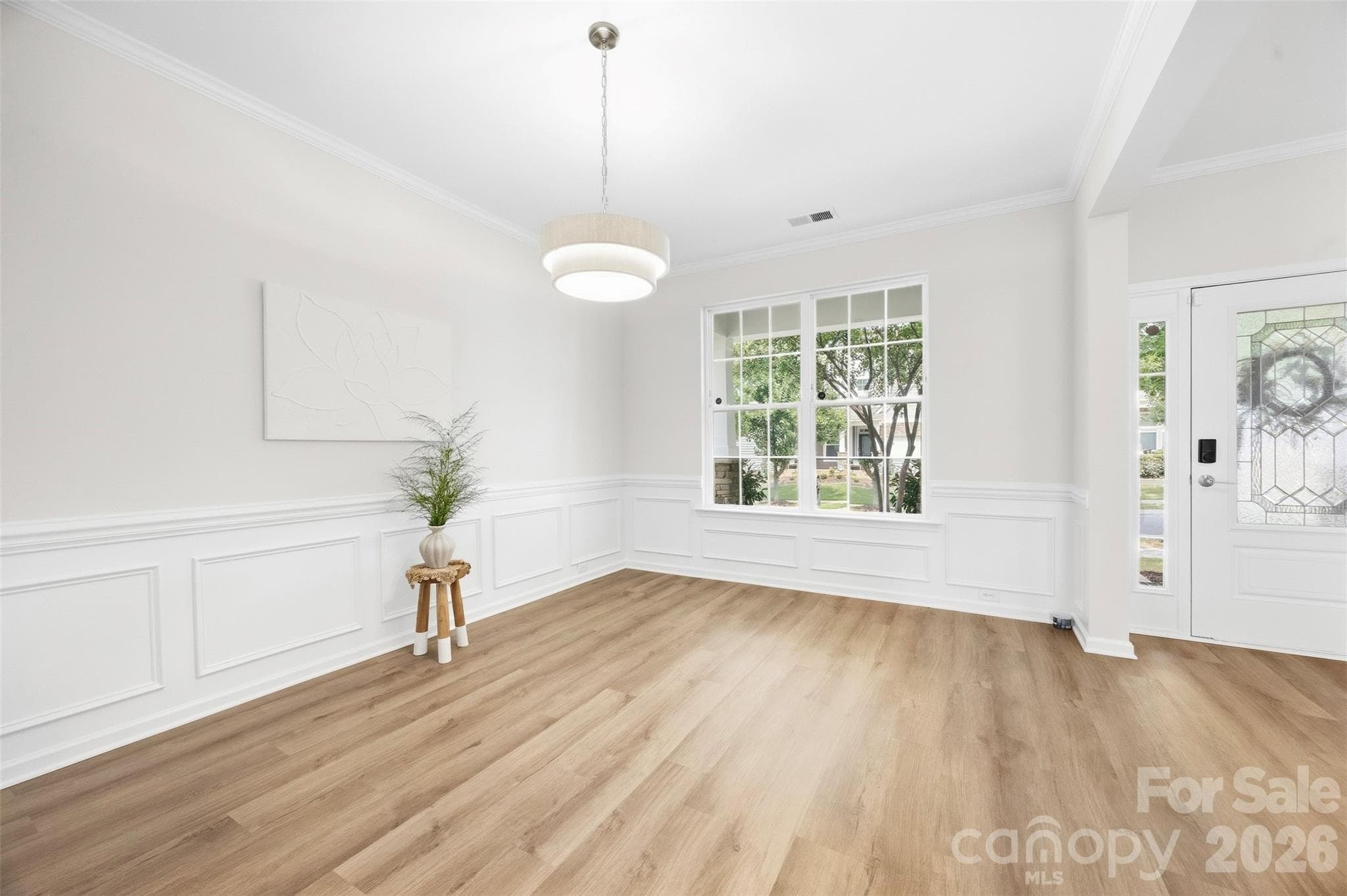 Large front-facing window brings natural light into the dining room - 2015 Kensley Drive, Waxhaw