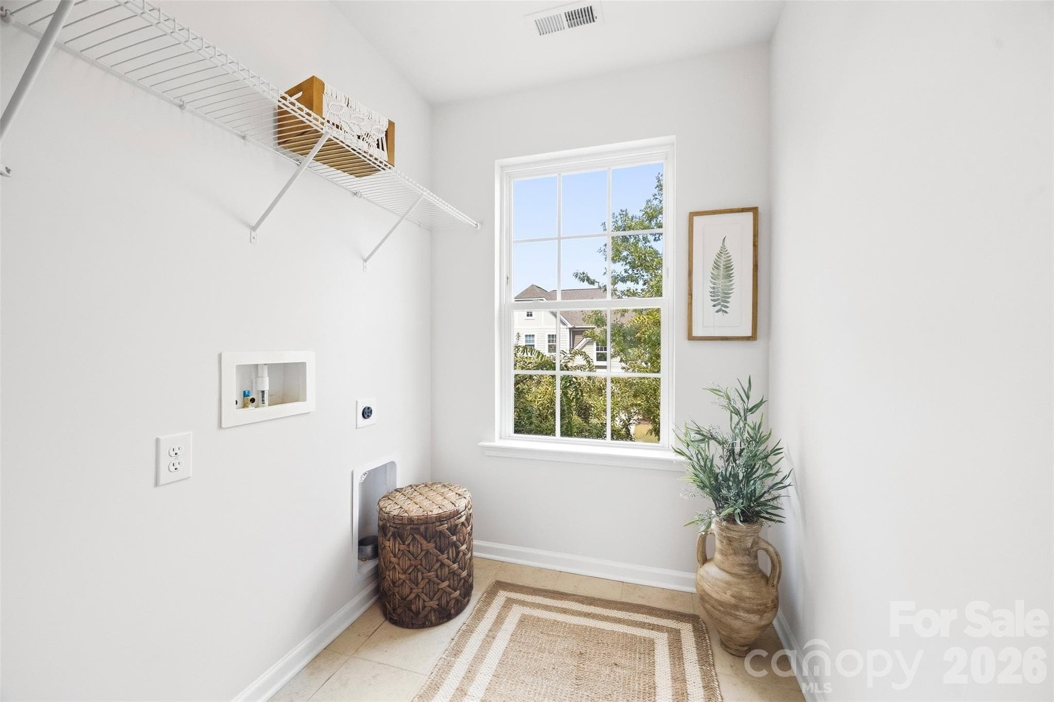 Shelving, natural light, and plenty of space for everyday organization - 2015 Kensley Drive, Waxhaw