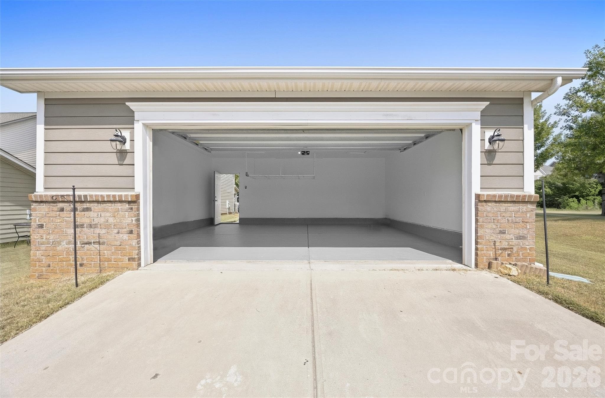 Detached two-car garage provides secure parking plus valuable additional storage space - 2015 Kensley Drive, Waxhaw