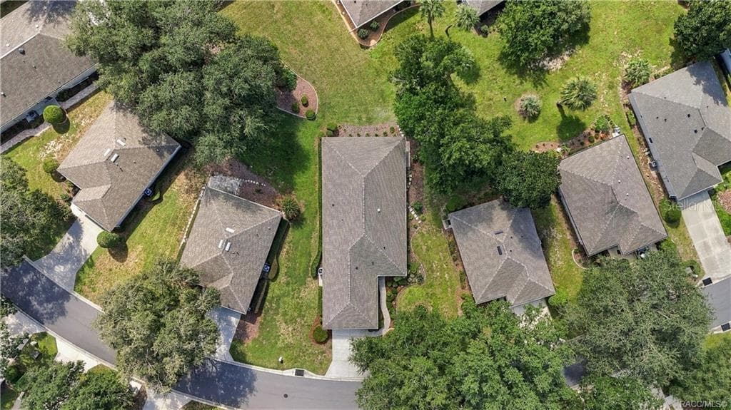 AERIAL PROPERTY VIEW – Overhead aerial showcasing the home’s placement within the neighborhood, driveway, mature trees, surrounding green space & neighboring properties. - 6410 W CANNONDALE DR, CRYSTAL RIVER