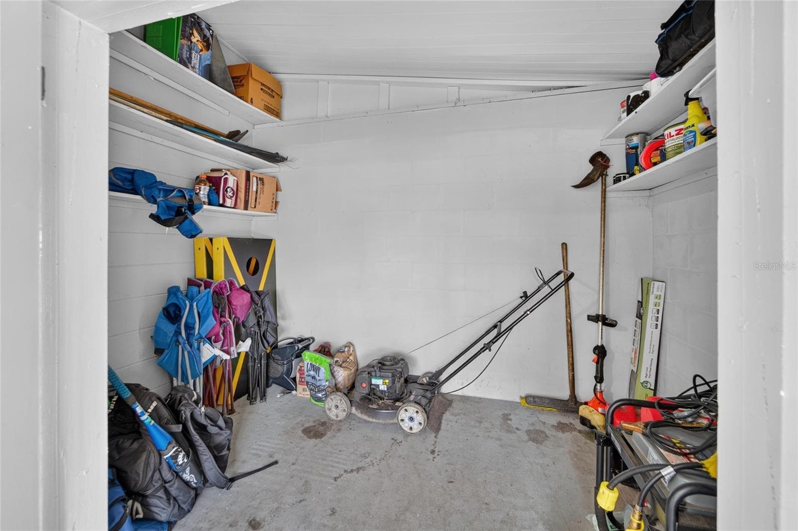 storage area inside patio - 703 INTERLACHEN PKWY, LAKELAND