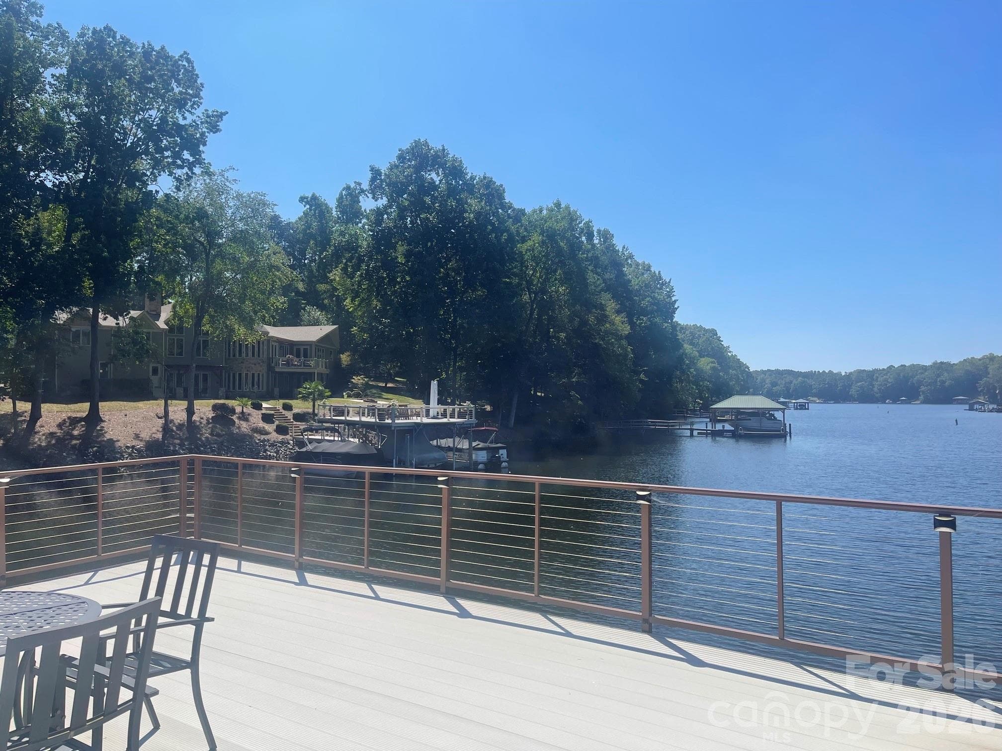 Aluminum decking and posts with cable railing so you can sit and enjoy your expansive views. - 140 Holt Lane, Mooresville
