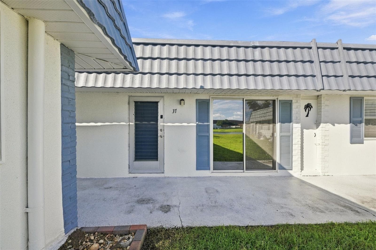 Home with sliding glass door to view water and wildlife - 1901 ANDOVER WAY #37, SUN CITY CENTER