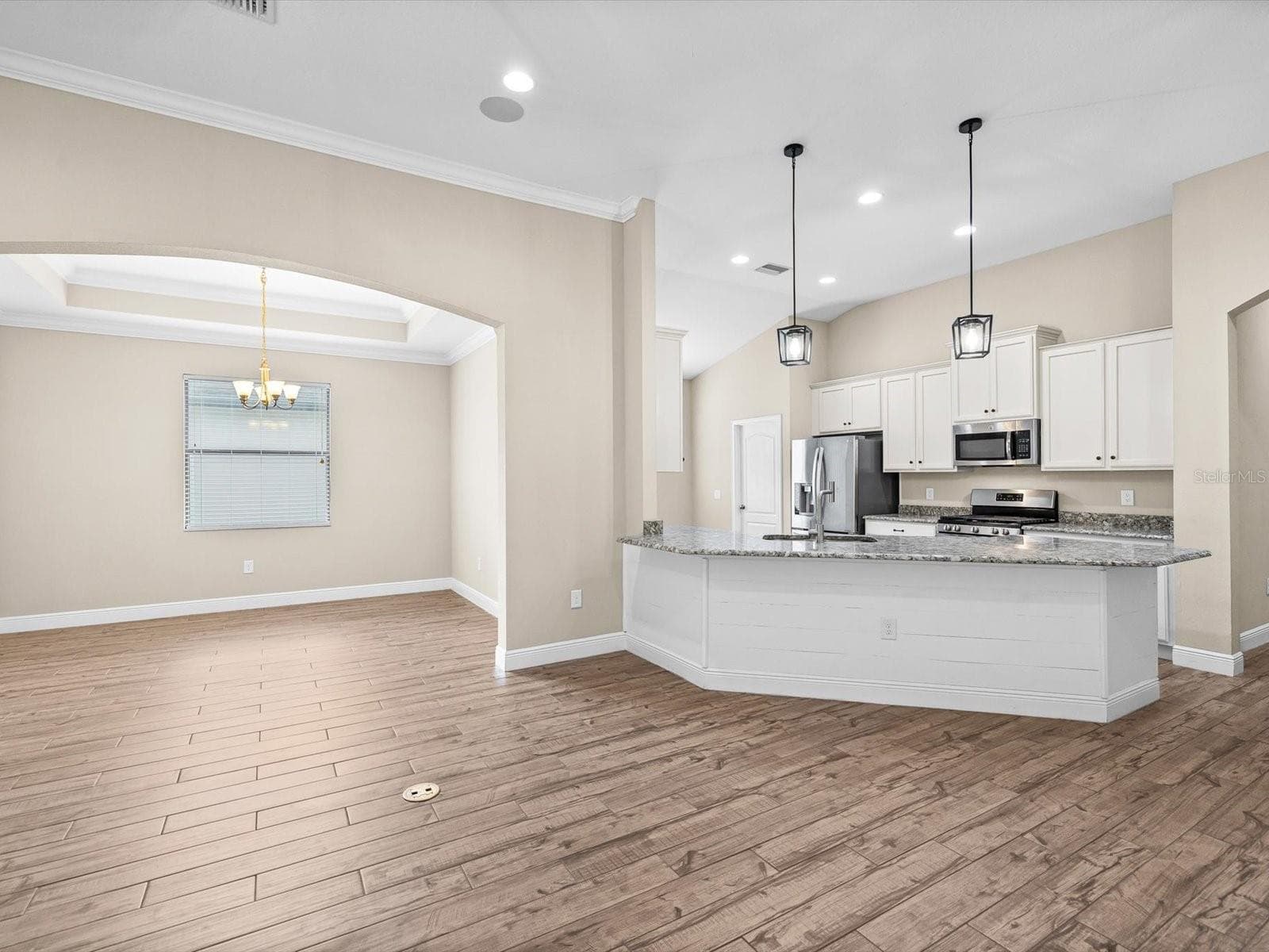 Great room/dinning room and Kitchen - 8519 MAY PORT CT, LAND O LAKES
