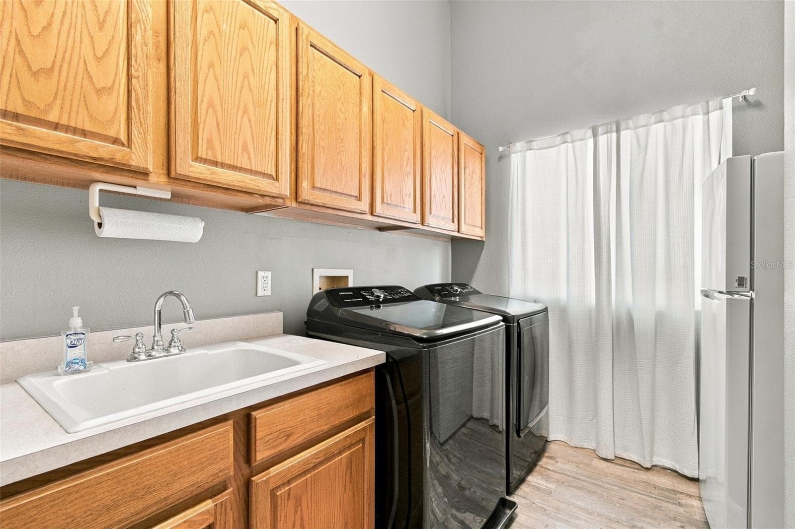 Spacious Laundry Room with Laundry Sink & plenty of room for Bulk Storage - 18115 EMERALD BAY ST, TAMPA