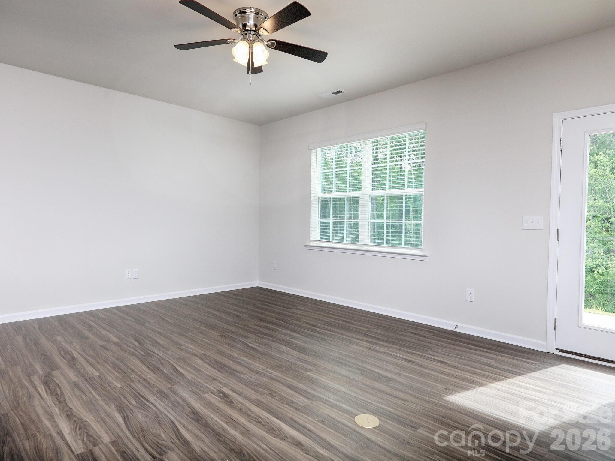 Vinyl plank floor throughout living area - 121 Olive Tea Lane, Statesville