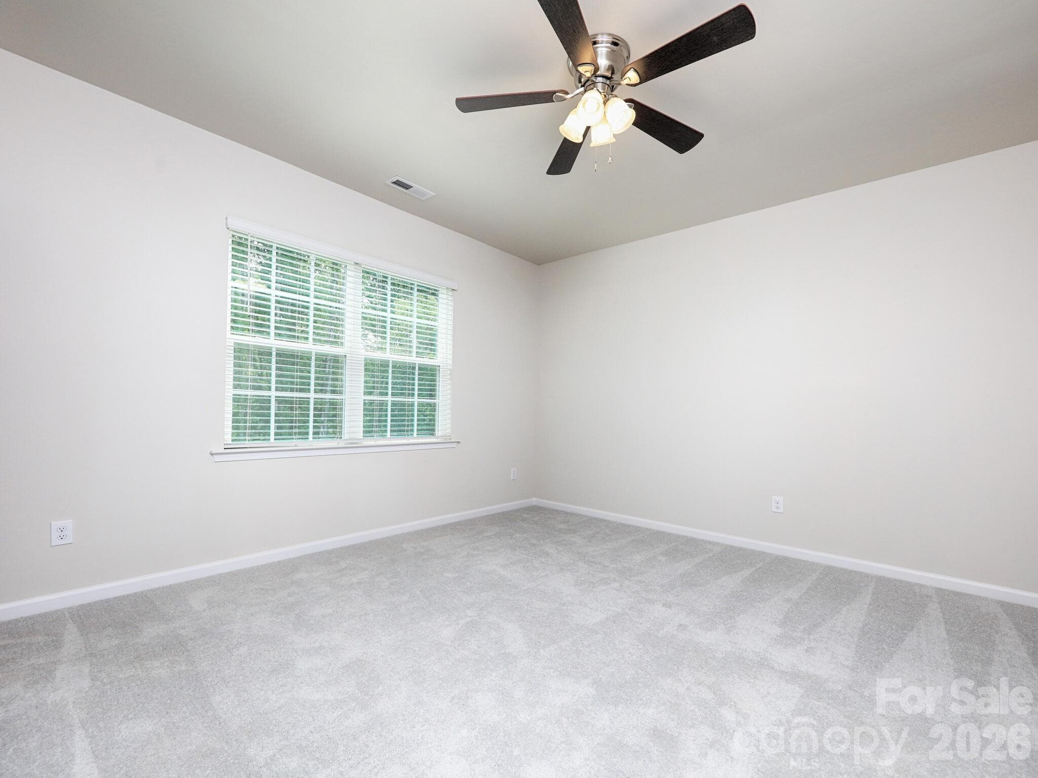 Primary bedroom has ceiling fan - 121 Olive Tea Lane, Statesville