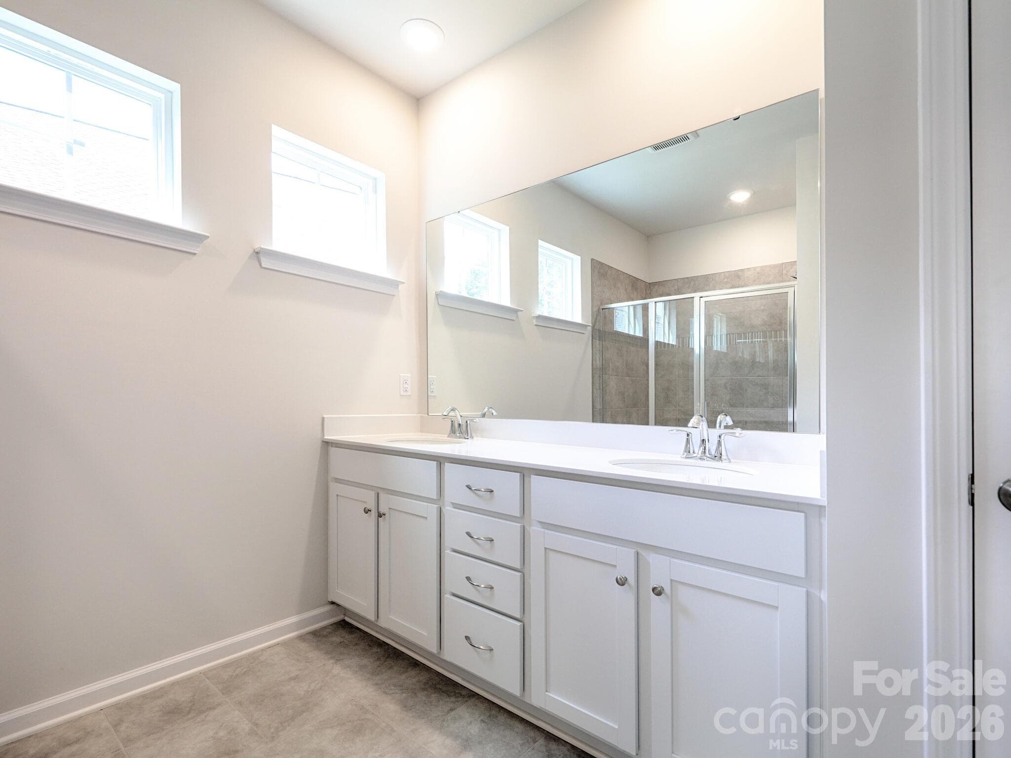 Primary ensuite bathroom with dual basin vanity - 121 Olive Tea Lane, Statesville
