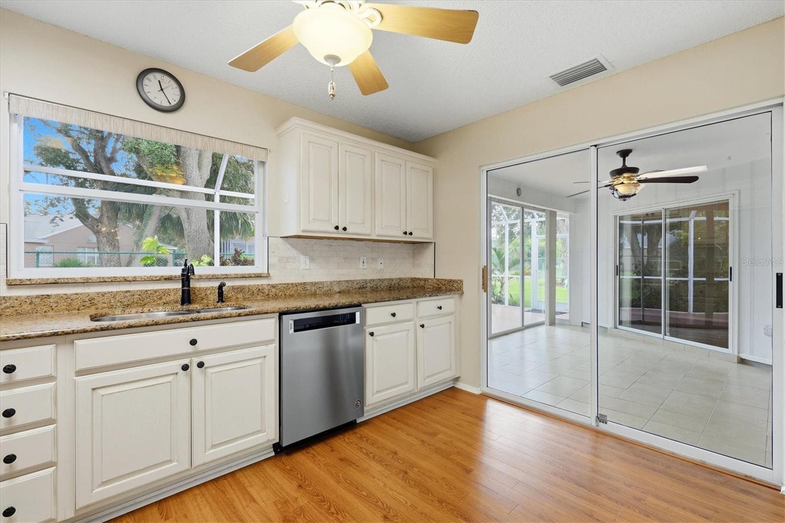 Kitchen Sliders Lead to Sunroom - 5837 GARDEN LAKES DR, BRADENTON