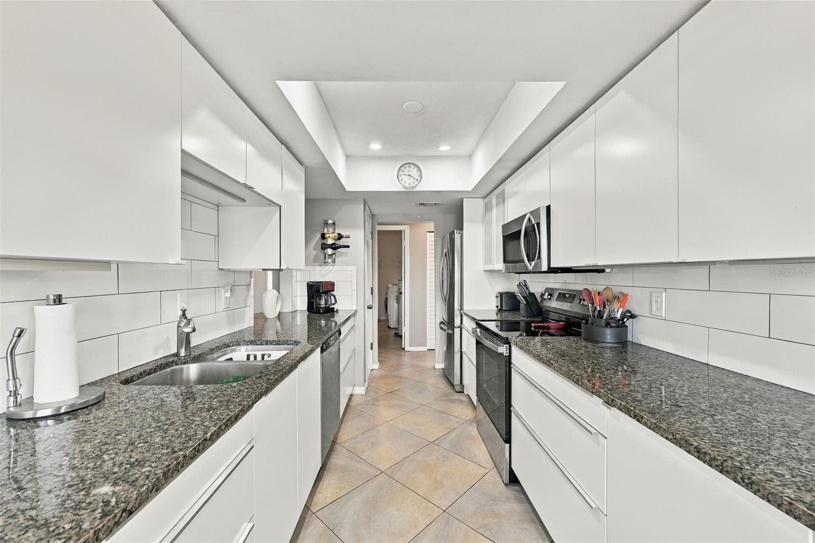 From the kitchen it is easy access to the laundry room and additional storage. - 211 STONEHAM DR, SUN CITY CENTER