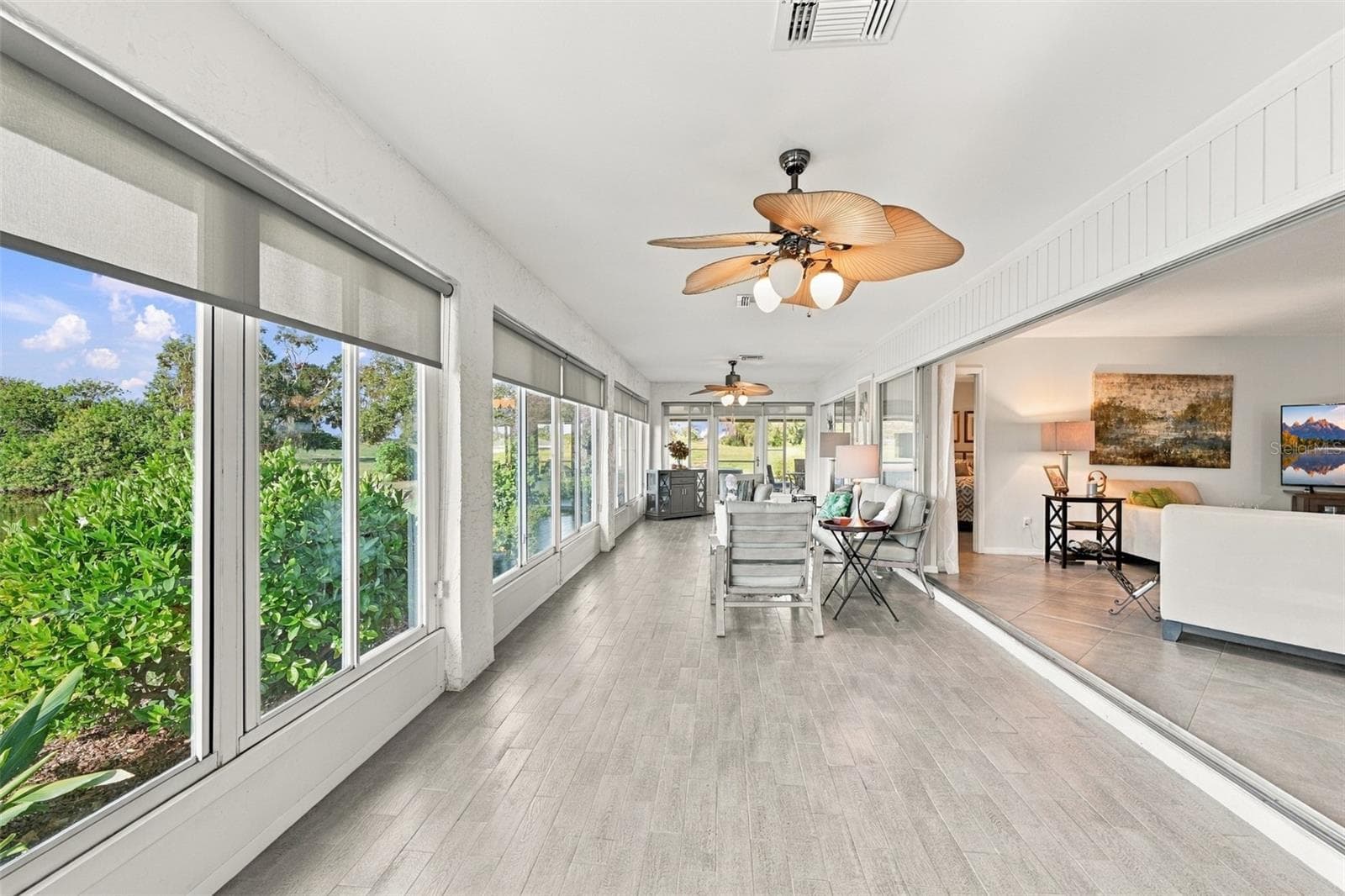The lovely tile flooring makes for easy cleaning and with multiple fans, there is always a breeze. Windows everywhere allow the outdoors to come right into your home. - 211 STONEHAM DR, SUN CITY CENTER