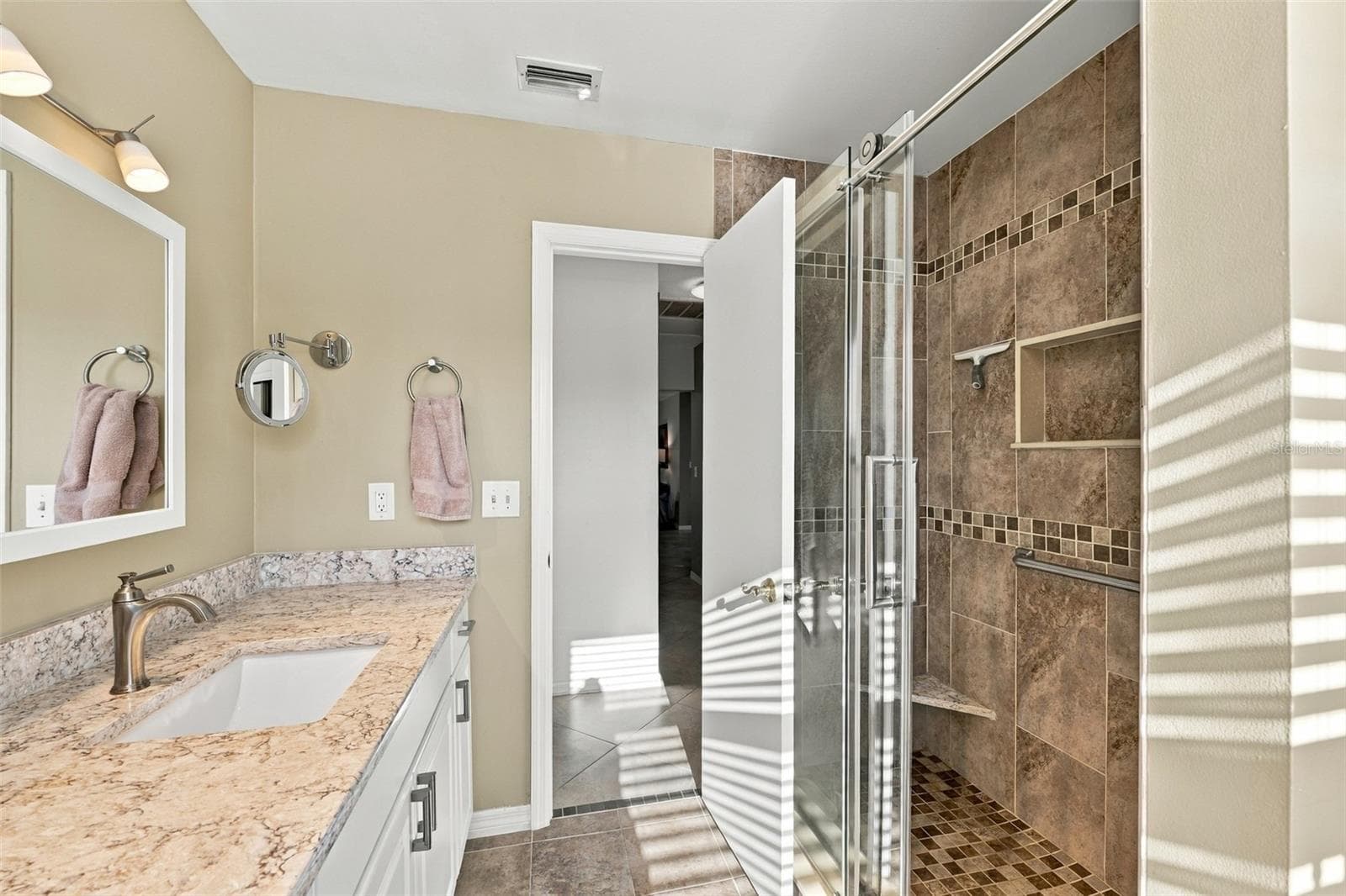 Guest bathroom has shower but no tub. - 211 STONEHAM DR, SUN CITY CENTER