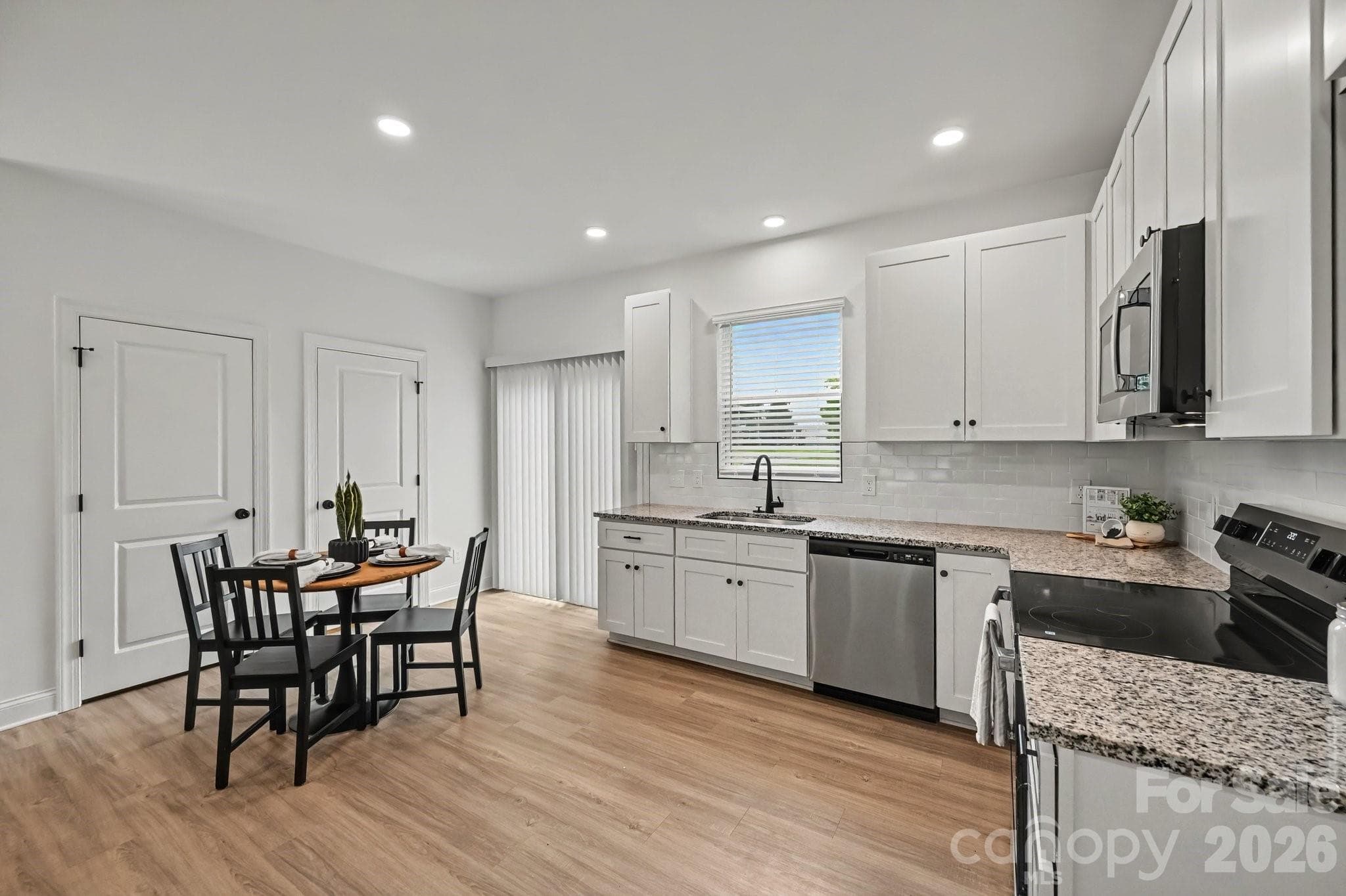 Kitchen and dining flow together beautifully. - 45 E 13th Street, Newton