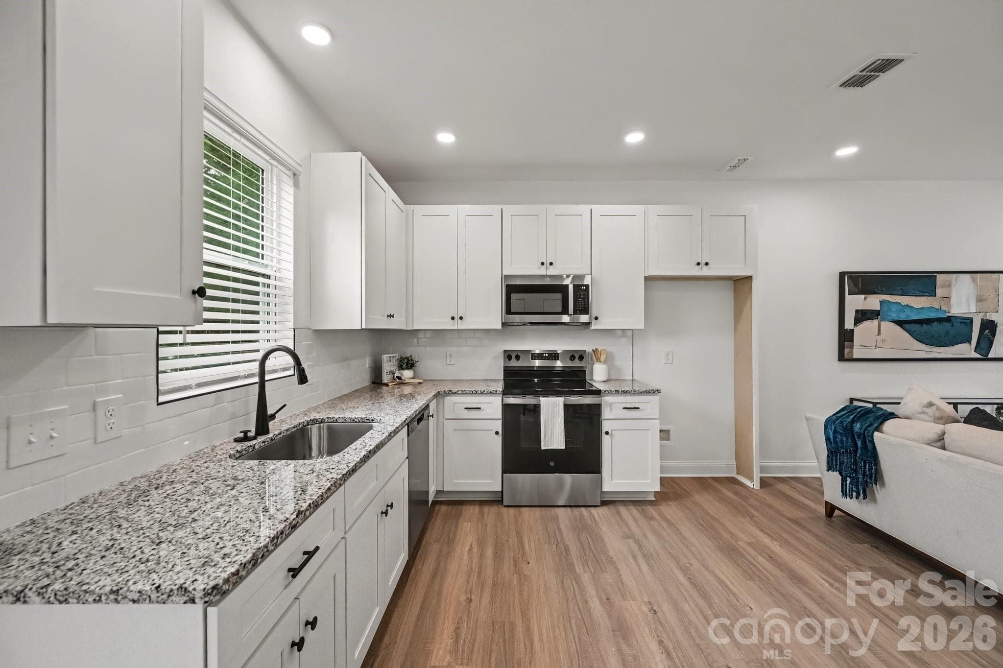 Stainless appliances complete the kitchen. - 45 E 13th Street, Newton