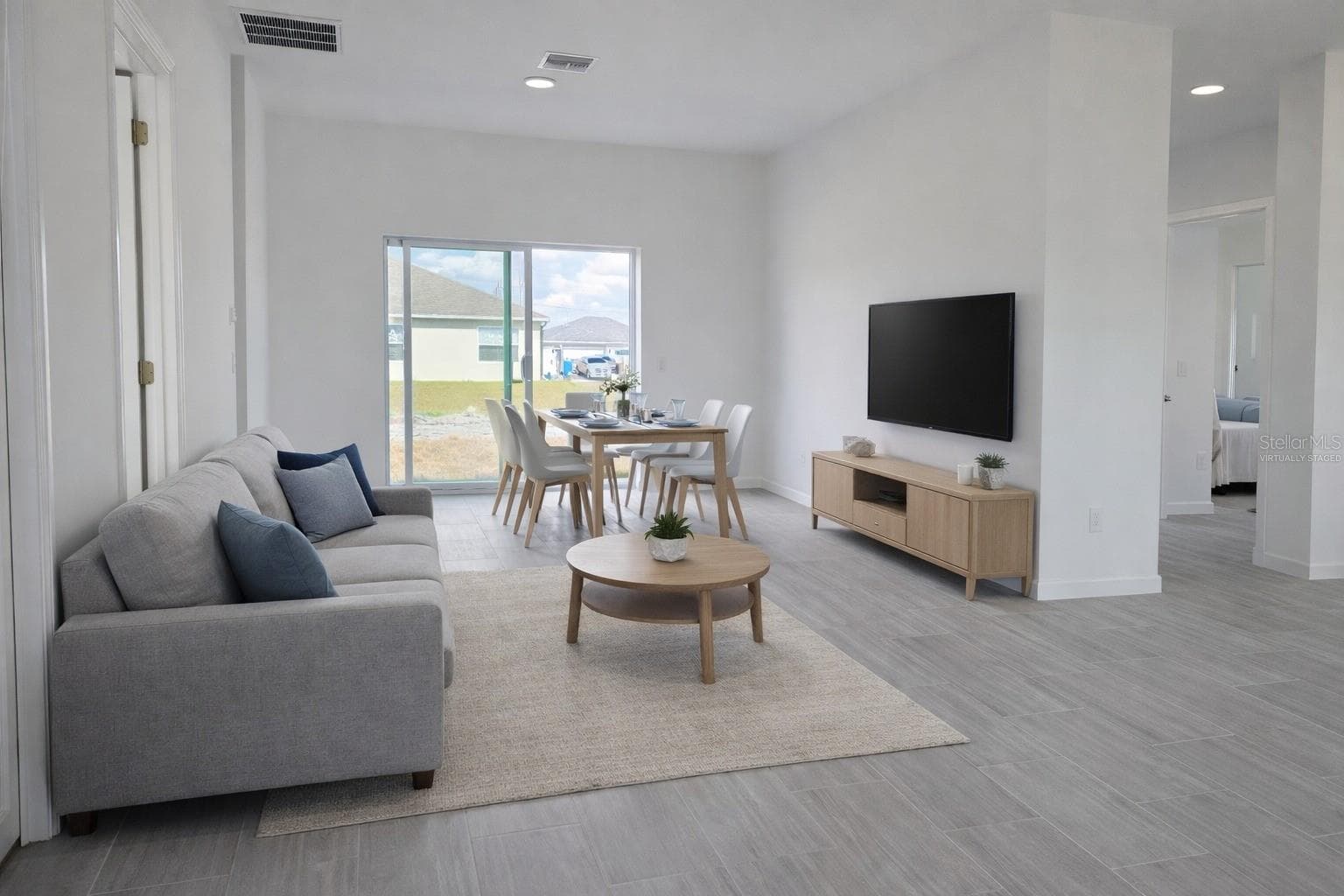 Virtually staged living and dining area - 416 COLUMBUS BLVD, LEHIGH ACRES