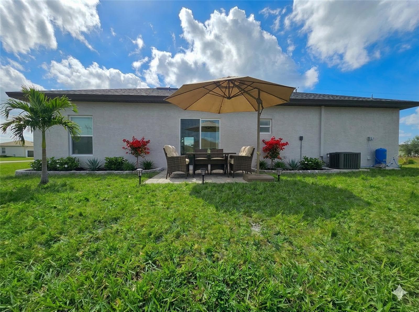 Covered rear patio and backyard - 416 COLUMBUS BLVD, LEHIGH ACRES