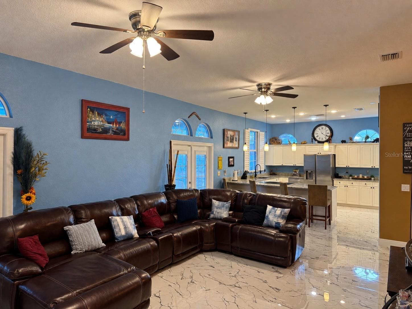Large living room with view to kitchen and access to backyard through French doors - 3009 W CLINTON ST, TAMPA