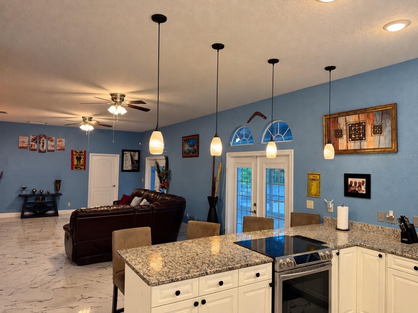 White cabinets and view to living room. Great for entertaining! - 3009 W CLINTON ST, TAMPA