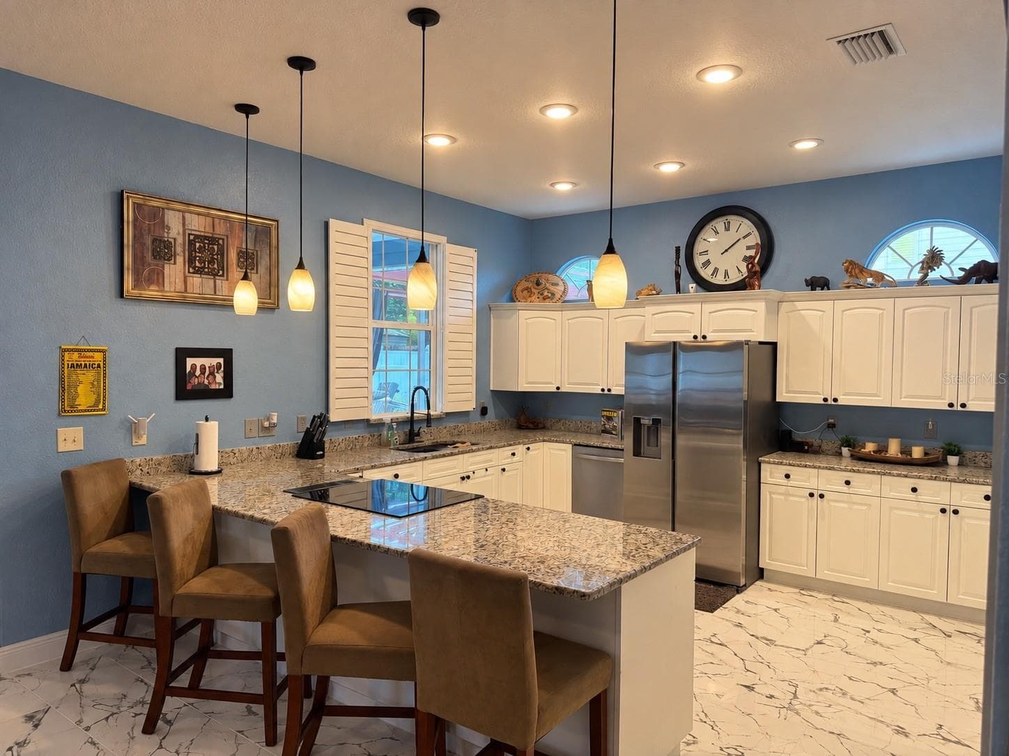 Backyard view from the kitchen sink, stainless steel appliances, granite counters, eat in kitchen - 3009 W CLINTON ST, TAMPA