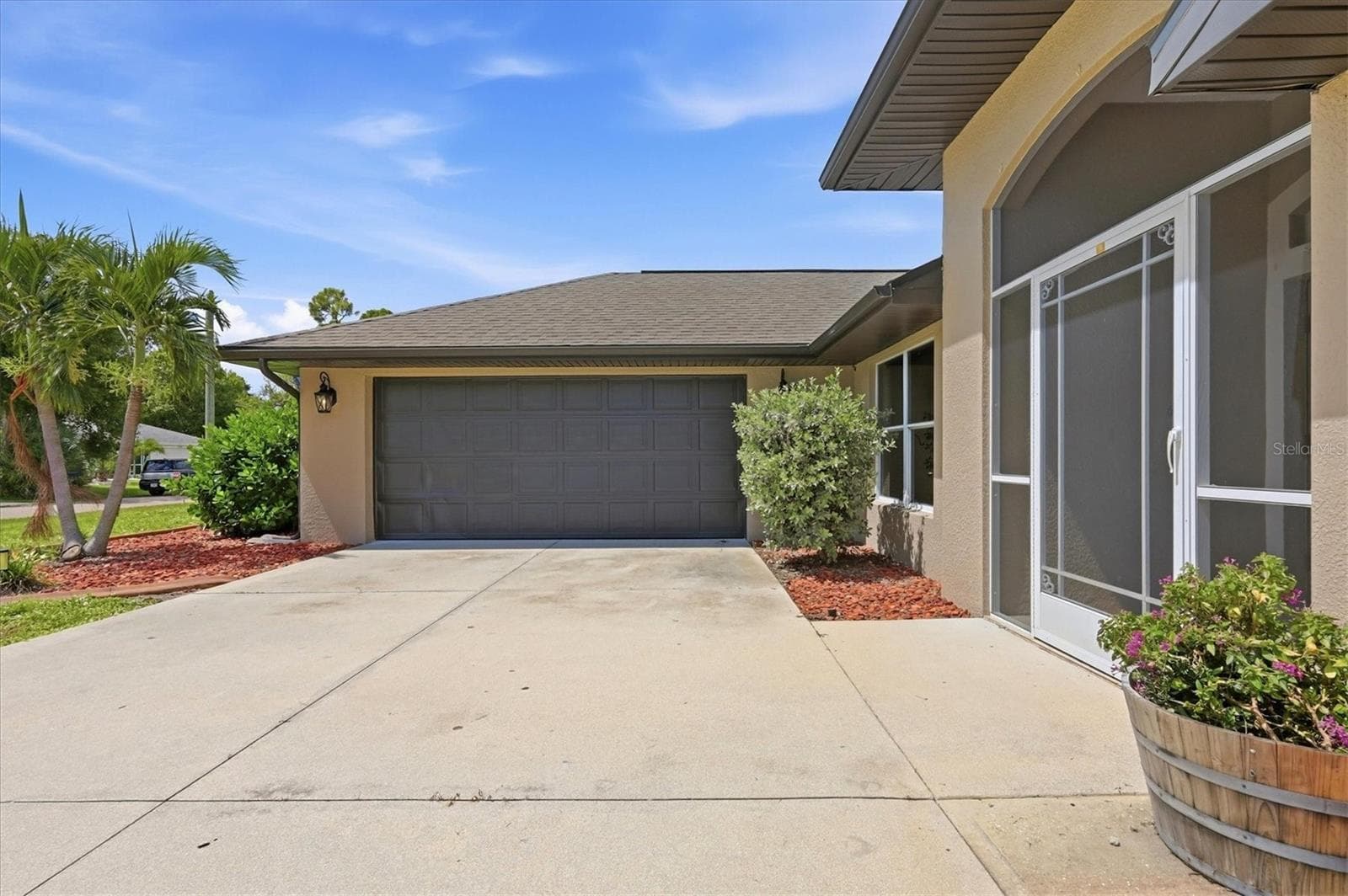 side entry garage makes for beautiful curb appeal - 23108 AUGUST AVE, PORT CHARLOTTE