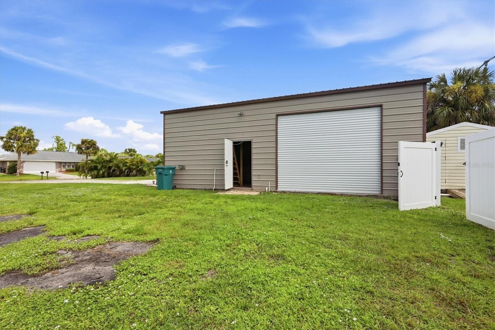 side overhead door as well as utility door - 23108 AUGUST AVE, PORT CHARLOTTE