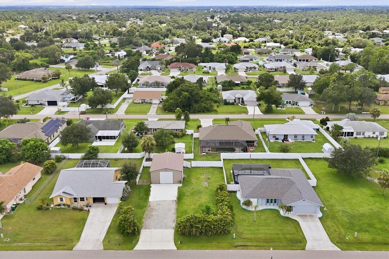 aerial overhead of garage and home to right behind - 23108 AUGUST AVE, PORT CHARLOTTE