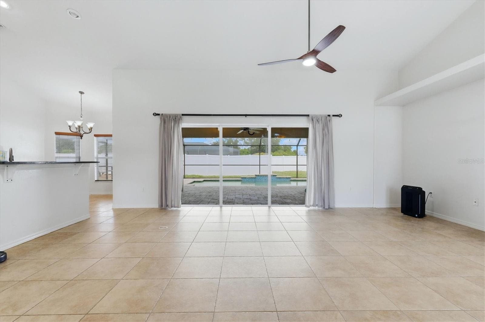 view of living room to left of entry, open and bright - 23108 AUGUST AVE, PORT CHARLOTTE