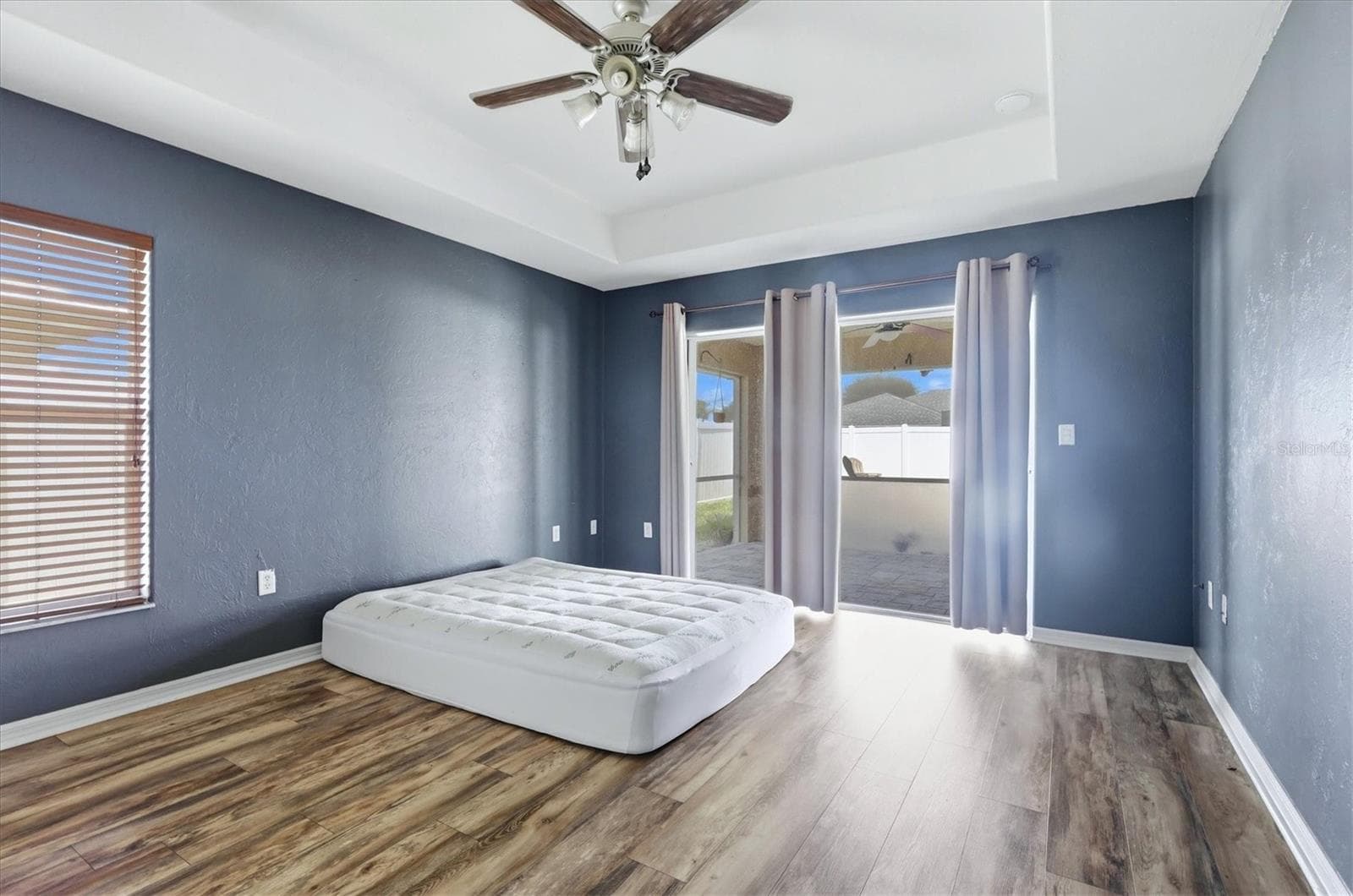 primary bedroom has sliders to its own section of lanai as well as en suite - 23108 AUGUST AVE, PORT CHARLOTTE