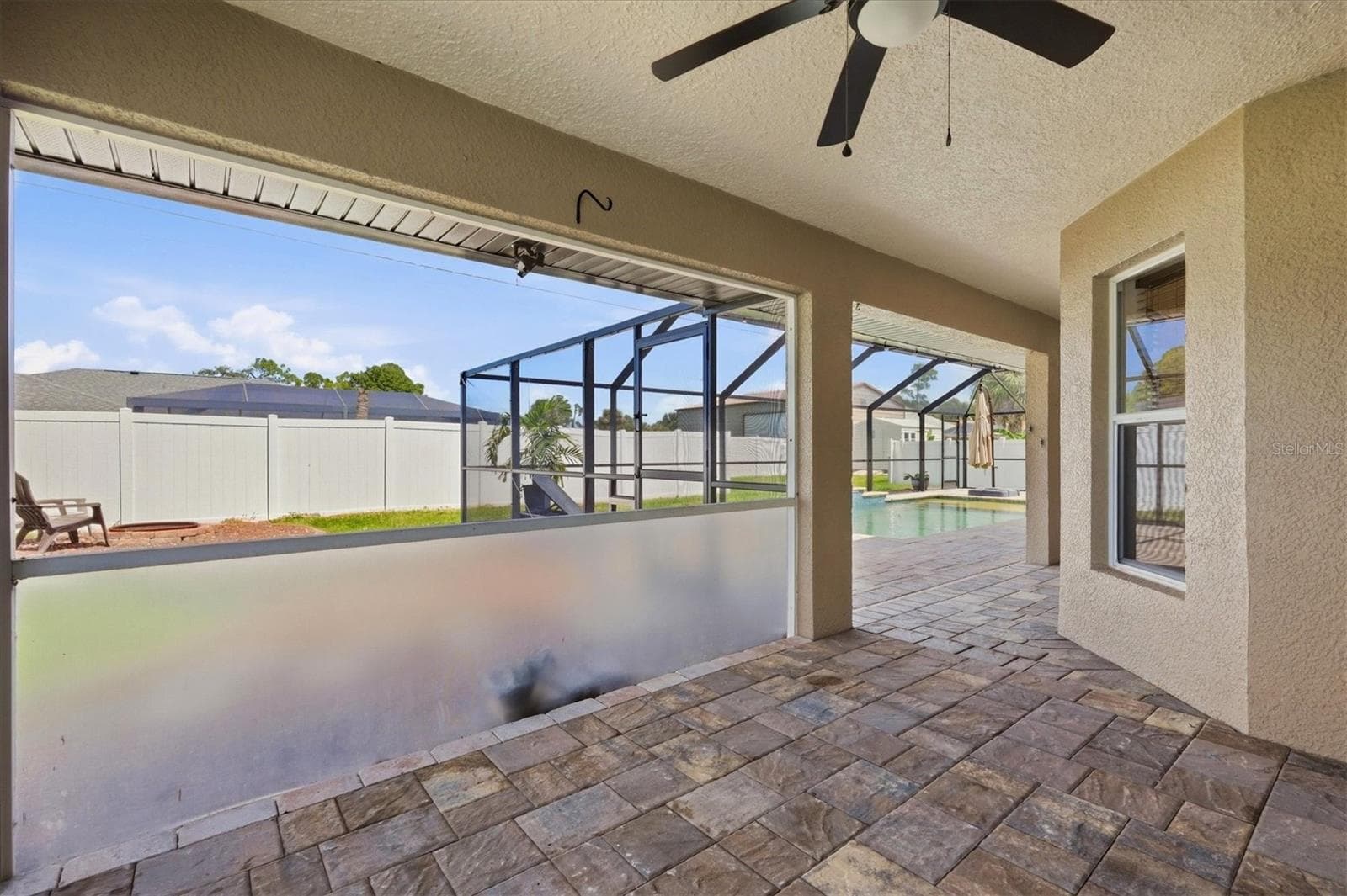 lanai area off of primary suite allows  you some privacy from the other section of lanai - 23108 AUGUST AVE, PORT CHARLOTTE