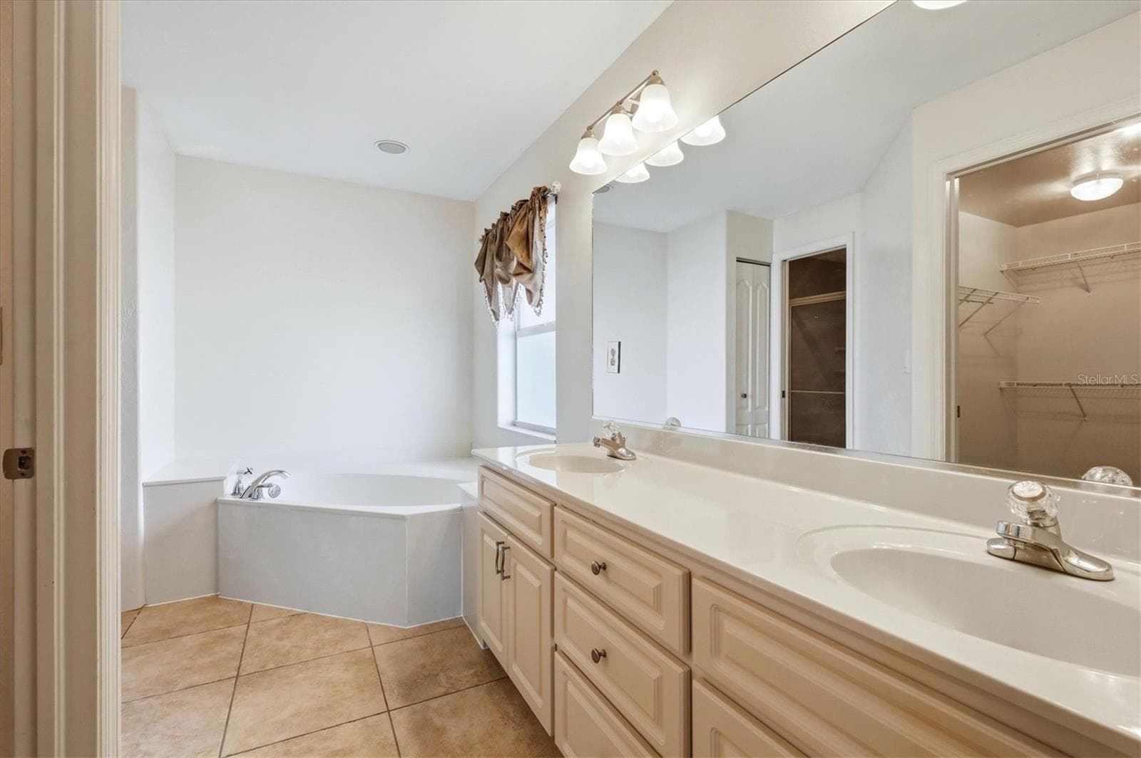 en suite with dual sink, garden tub and separate water closet that includes step in shower - 23108 AUGUST AVE, PORT CHARLOTTE