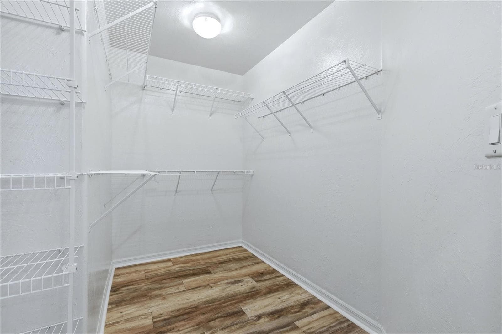 what's not to love about a spacious walk in closet in primary - 23108 AUGUST AVE, PORT CHARLOTTE