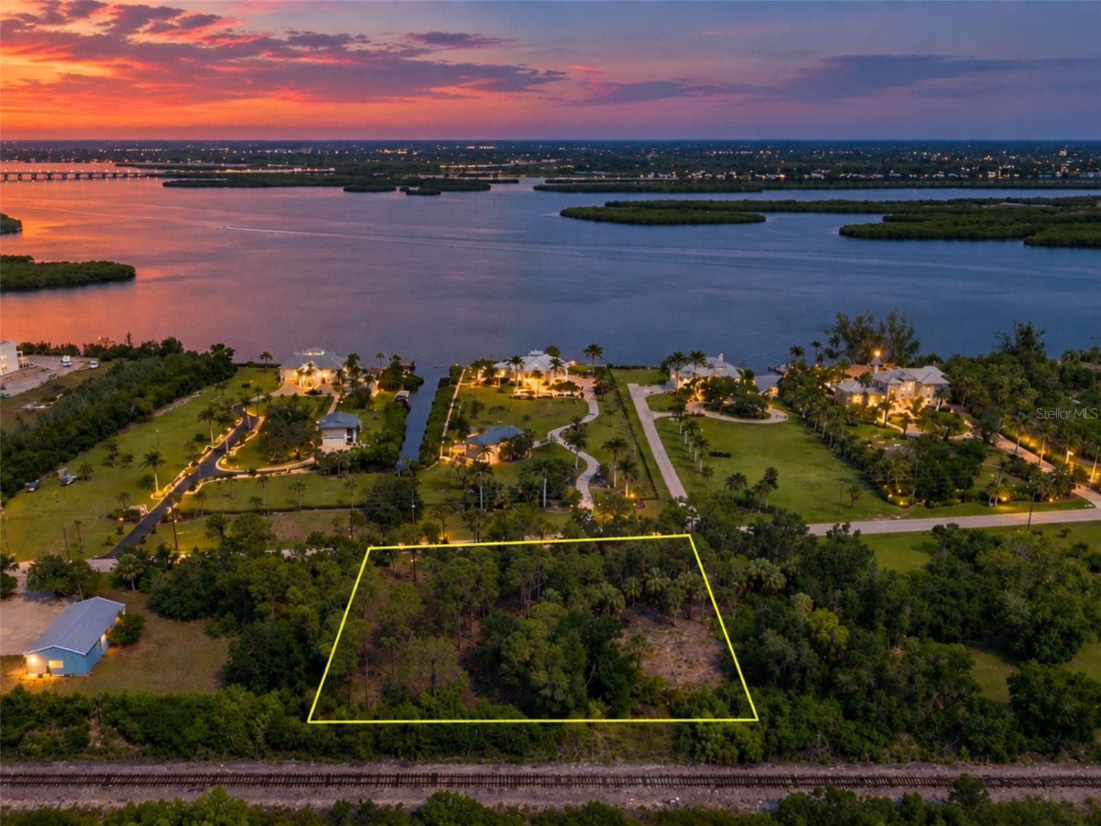 Digitally enhanced to depict dusk lighting. - 4685 RIVERSIDE DR, PUNTA GORDA