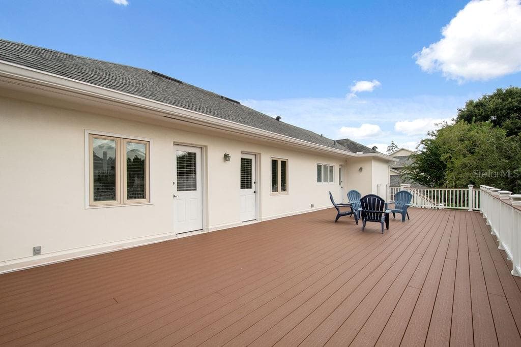 Upper deck runs the length of the home with access from upstairs bedrooms. - 555 E LAKE SUE AVE, WINTER PARK