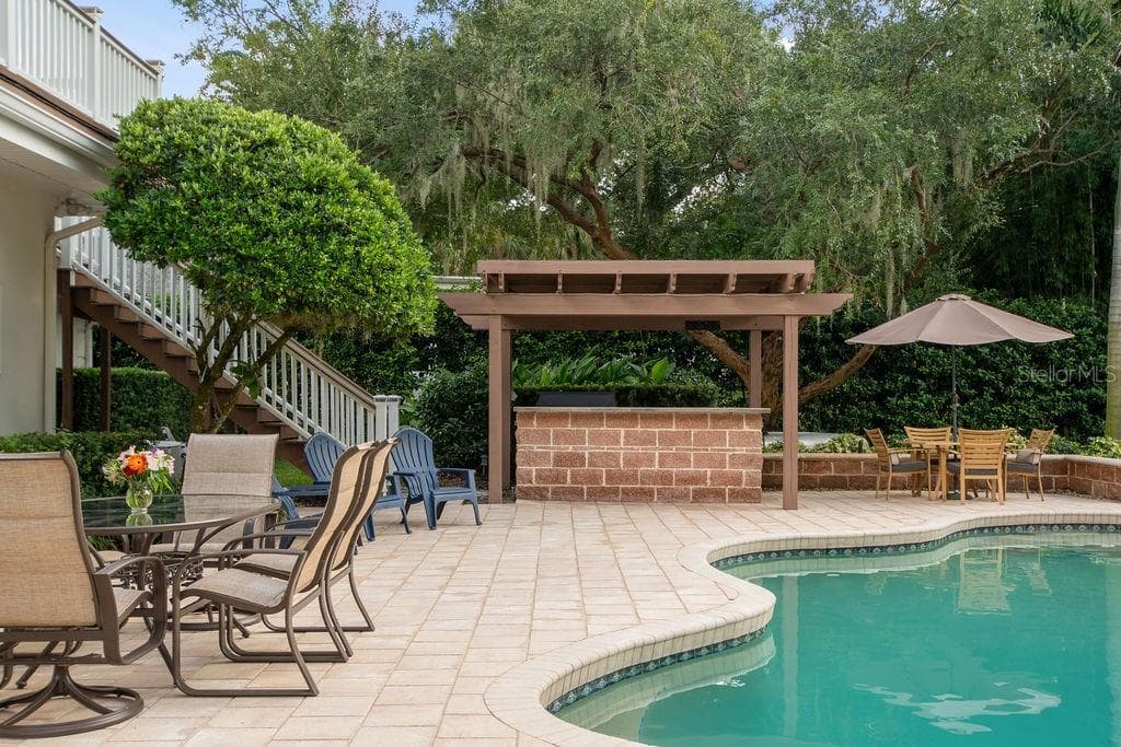 Exterior staircase leading to pool deck. - 555 E LAKE SUE AVE, WINTER PARK