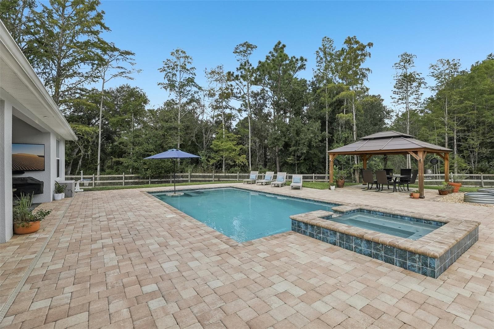 Built in 2018, the home features FRESH INTERIOR AND EXTERIOR PAINT (2026), professionally selected finishes, high ceilings, a 3-WAY SPLIT FLOOR PLAN and a spectacular HEATED, SALT-WATER POOL WITH SPA, added in 2025. - 19179 SABAL ST, ORLANDO