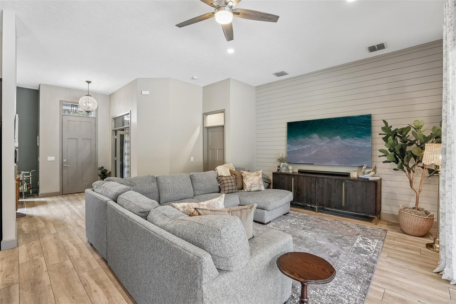 Inside, you'll immediately appreciate the HIGH CEILINGS and beautiful WOOD-LOOK TILE FLOORING flowing throughout the main living areas. - 19179 SABAL ST, ORLANDO