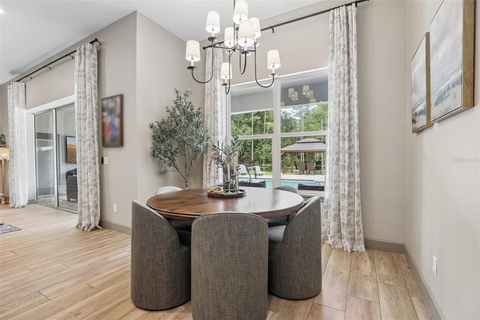 The heart of the home is the spacious Kitchen, Dining Area and Family Room, which flow seamlessly together in an inviting OPEN-CONCEPT DESIGN filled with NATURAL LIGHT. - 19179 SABAL ST, ORLANDO