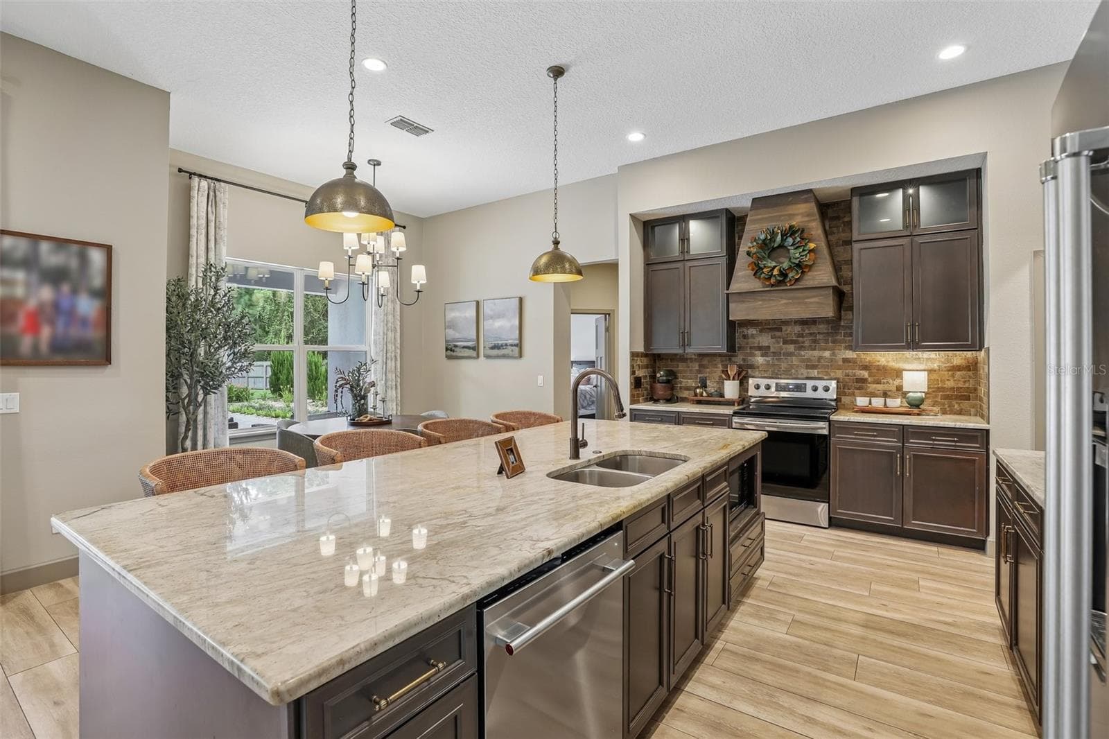 The Kitchen island includes space for counter-height seating. - 19179 SABAL ST, ORLANDO