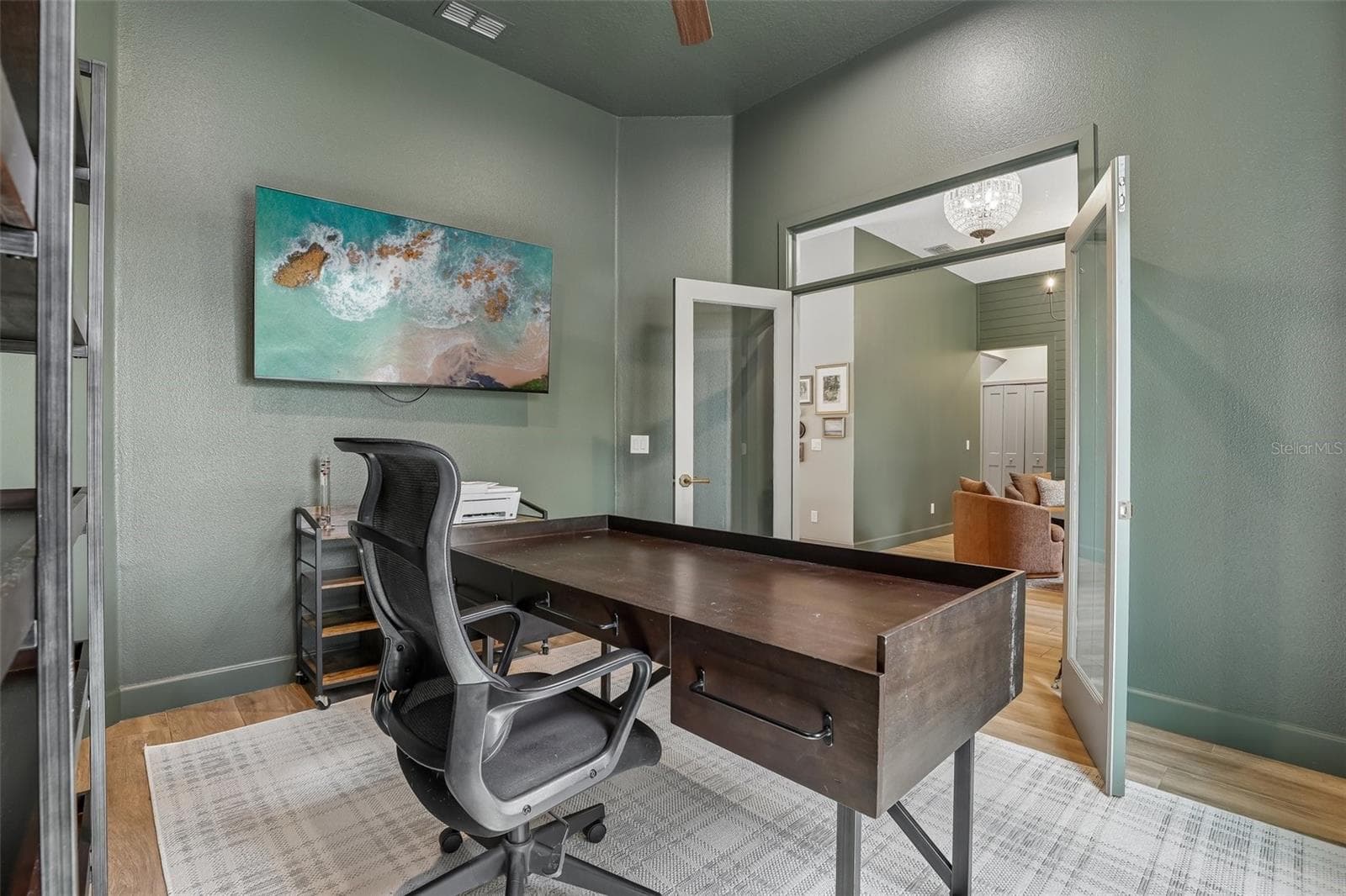 Glass French doors open to a versatile OFFICE OR FLEX SPACE. - 19179 SABAL ST, ORLANDO
