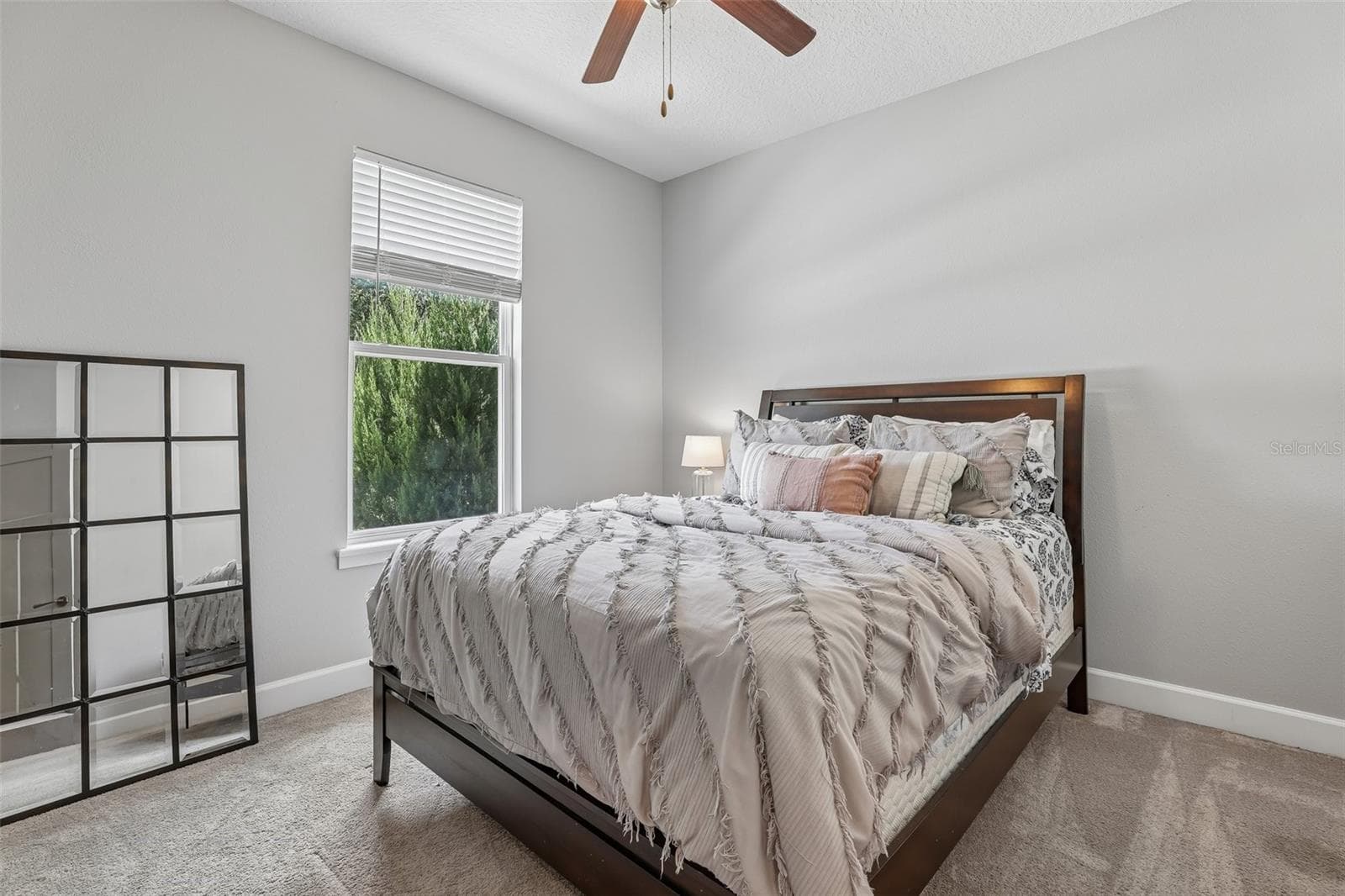 Three additional carpeted bedrooms are thoughtfully positioned on the opposite side of the home. Bedroom 2 - 19179 SABAL ST, ORLANDO